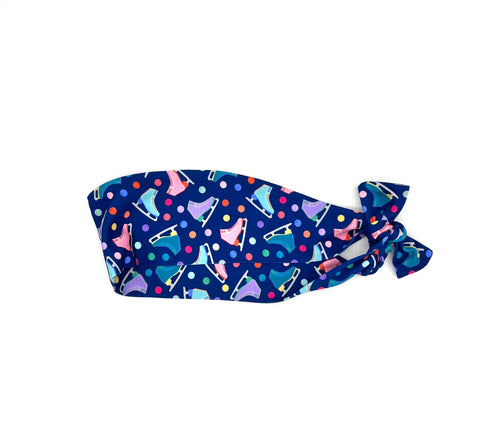 Wide Navy blue headband with colorful ice skates and polka dots on a white background