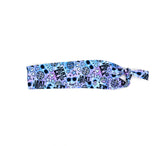 Blue headband with black text "I'm in my Swiftie Era" and disco balls, hearts and stars on a white background